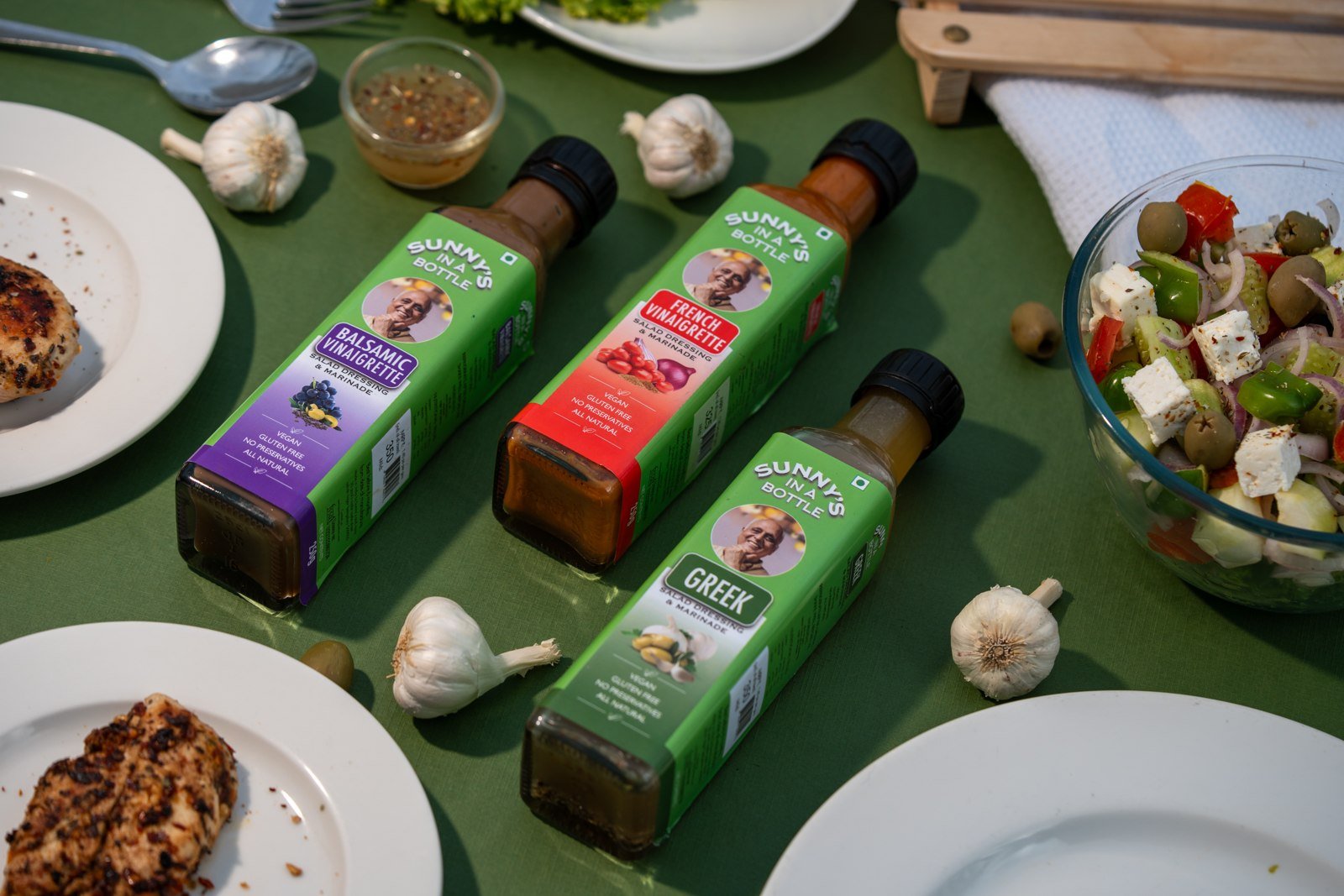 Sunny's In A Bottle Balsamic Vinaigrette, French Vinaigrette and Greek dressing flatlay