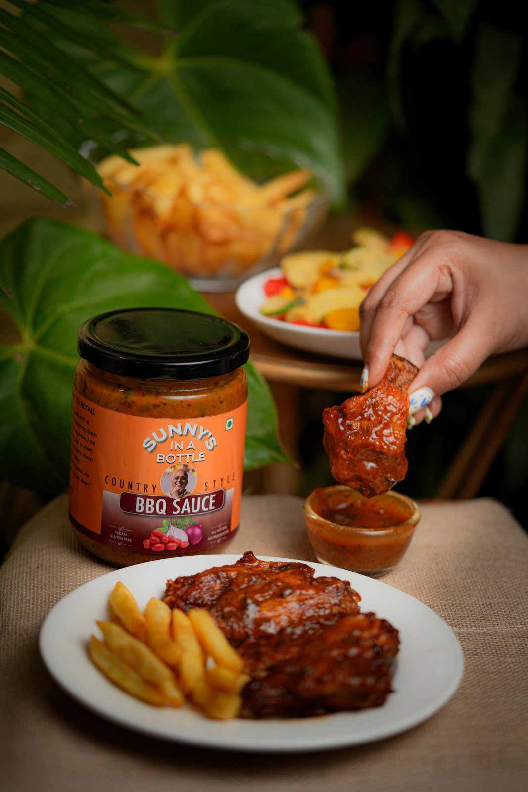 Sunny's In A Bottle Country Style BBQ Sauce with chicken wings and fries